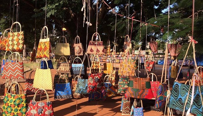Capulana bags hanging at an open-air crafts fair